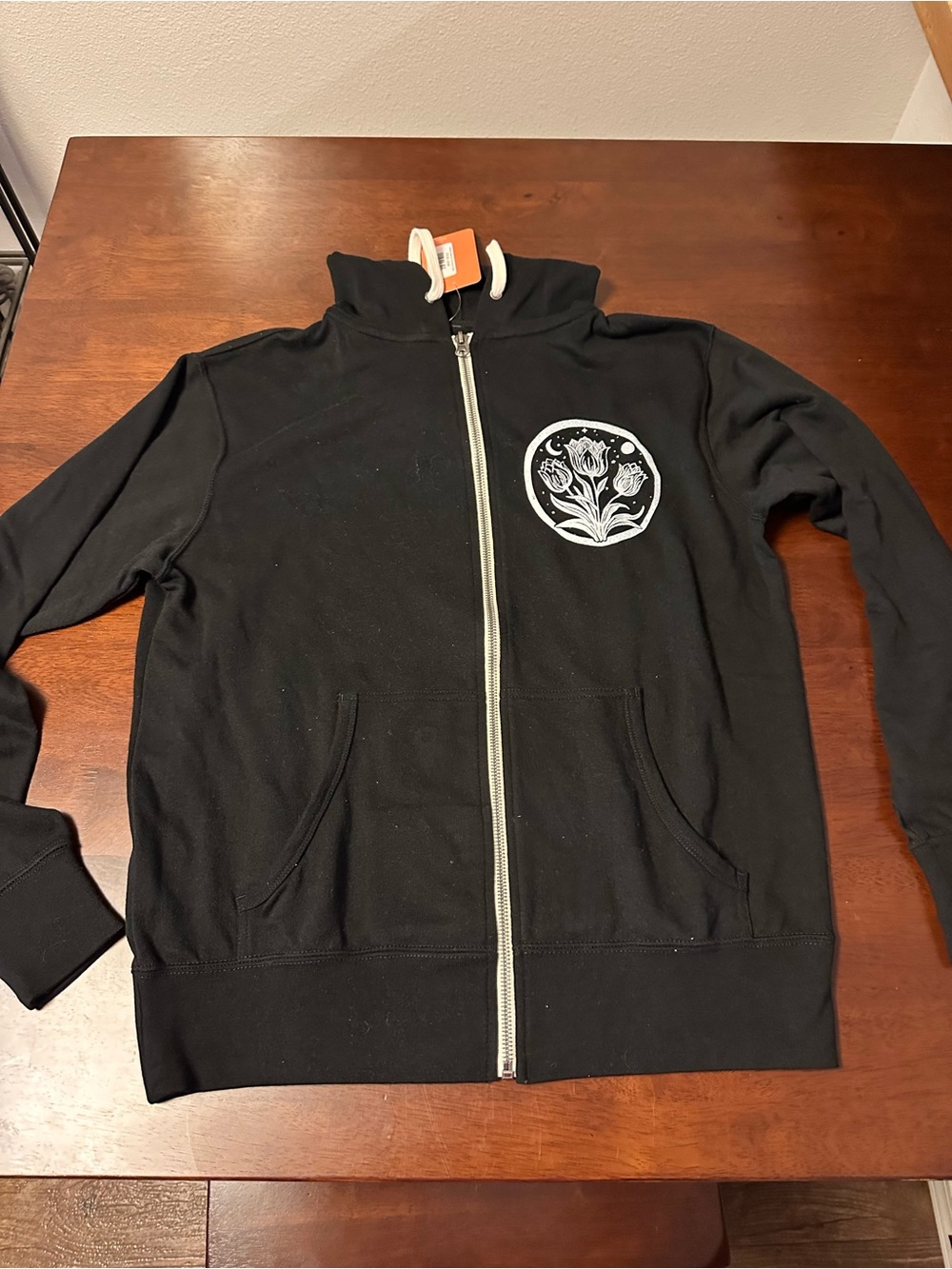 Black Zip-Up Hoodie with White Floral Chest Emblem